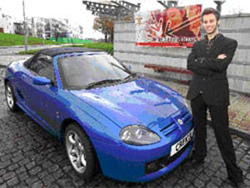 Lee Crossley with the car he bought after founding his own business