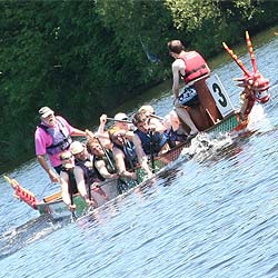 The NuBlue team paddling fiercely on the River Lune