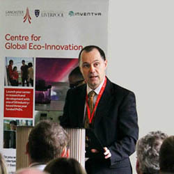 Vice Chancellor Mark E. Smith congratulates the businesses, graduate researchers and academic staff involved