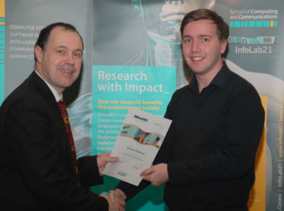 Vice-Chancellor Mark Smith presents a certificate for the Summer Placement Scheme to Harrison Fleetwood