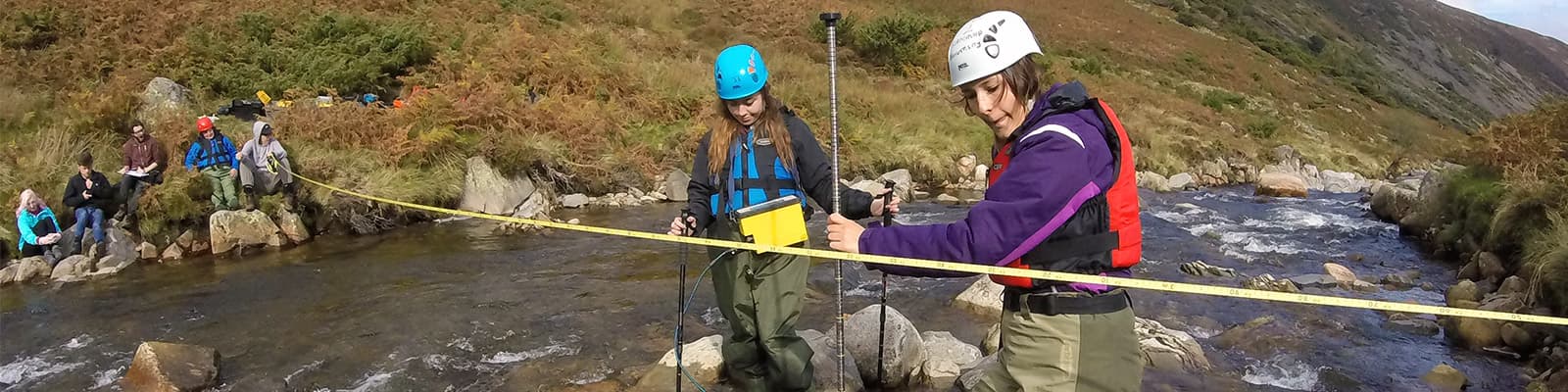 Students take readings from a river on Carrock Fell