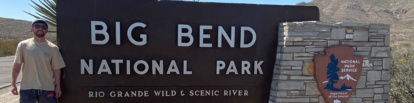 David Magee stood in front of a sign for Big Bend National Park