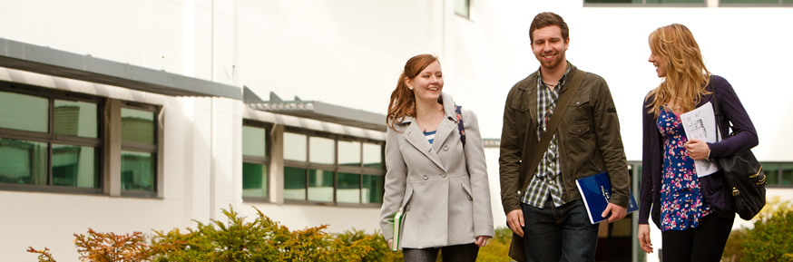 Students walking across campus chatting