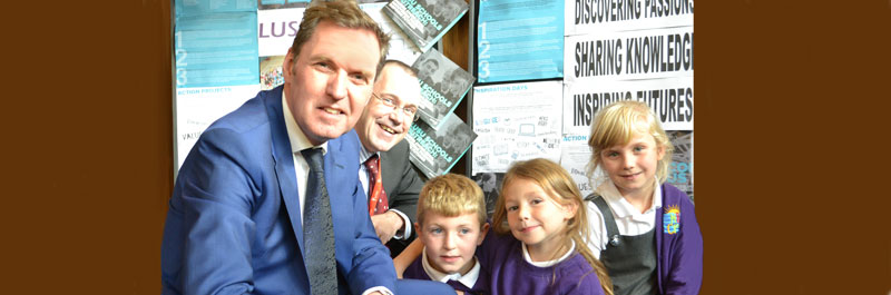 Alan Milburn and the Vice-Chancellor with pupils from Morecambe Bay Community Primary School