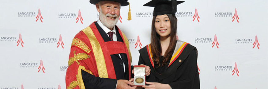 The Chancellor Sir Chris Bonington with medallist Si Wen 