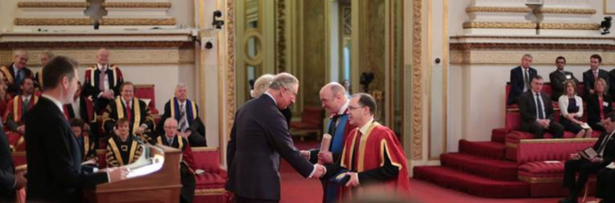 Vice Chancellor Professor Mark E. Smith and Distinguished Professor Tony McEnery receiving The Queen’s Anniversary Prize from The Prince of Wales and The Duchess of Cornwall.