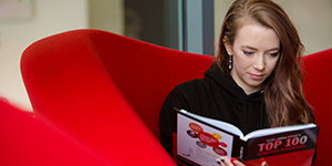 A student reading a careers guide