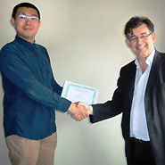 Xi Chen receiving his prize