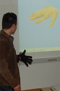 A student trying out a virtual reality glove in Lancaster University's Computing Department during the 2007 Taster Day
