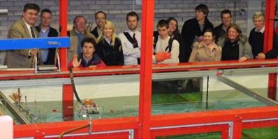 Dr G A Aggidis LUREG Director (left) with marine energy researchers at the LUREG Wave Tank Testing Facility