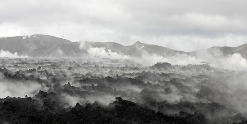 The lava flow field the day after heavy rains. Over a hundred litres of rain fell on each square metre of lava, and the lava is so hot inside that almost all of this rainwater will turn to steam