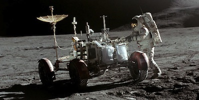The Apollo 15 Lunar Rover on the surface of the Moon with astronaut Jim Irwin alongside. Tracks in the dusty lunar soil are clearly visible. Photo: NASA