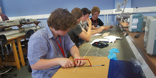 Visiting school pupils design bridges in the Engineering workshop