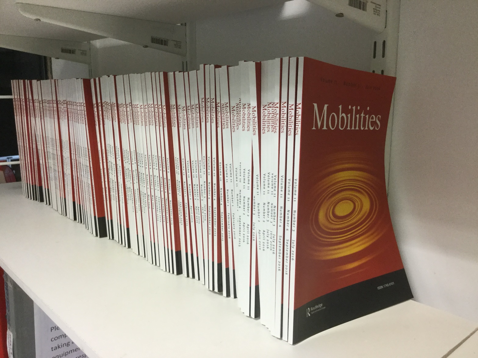 Mobilities journal on bookshelf