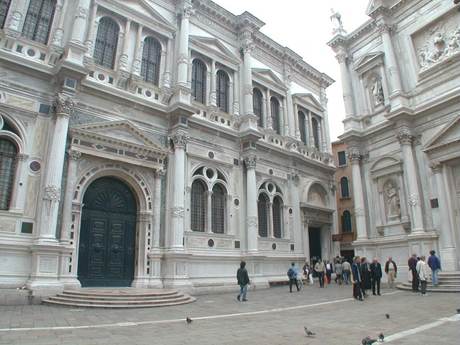 Scuola Grande di San Rocco to the left, and Church of San Rocco to the right Photograph by George P. Landow,  October 2000. It may be used for any scholarly or educational purpose without permission, as long as the previous credit appears.