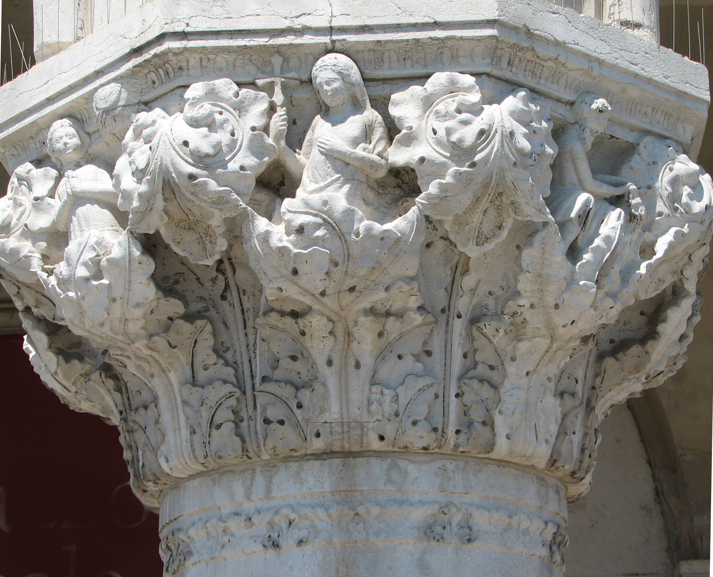 Detail of 9th capital in its current state. Hope, side 8, left; Faith, side 1, centre