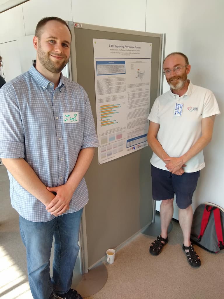 Matt Coole and Paul Rayson stood next to poster
