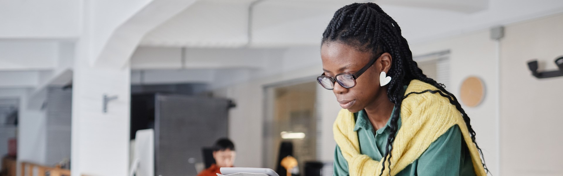 Black woman reading at work