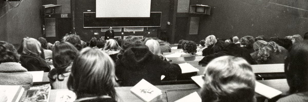 A black and white photo of a lecture theatre in the 1960s