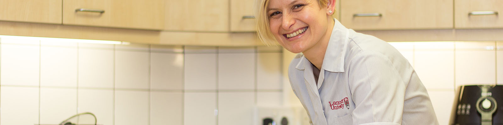 Cleaner wiping a kitchen table