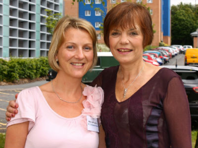 Two women standing next to each other