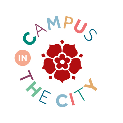 A logo featuring a red rose in its centre and the words 'Campus in the City' around it.