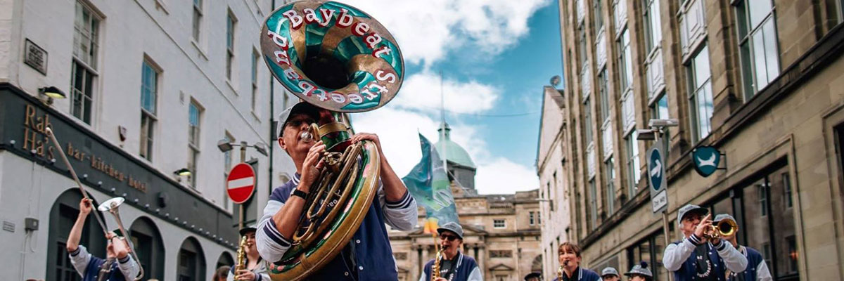 A brass band play in the street