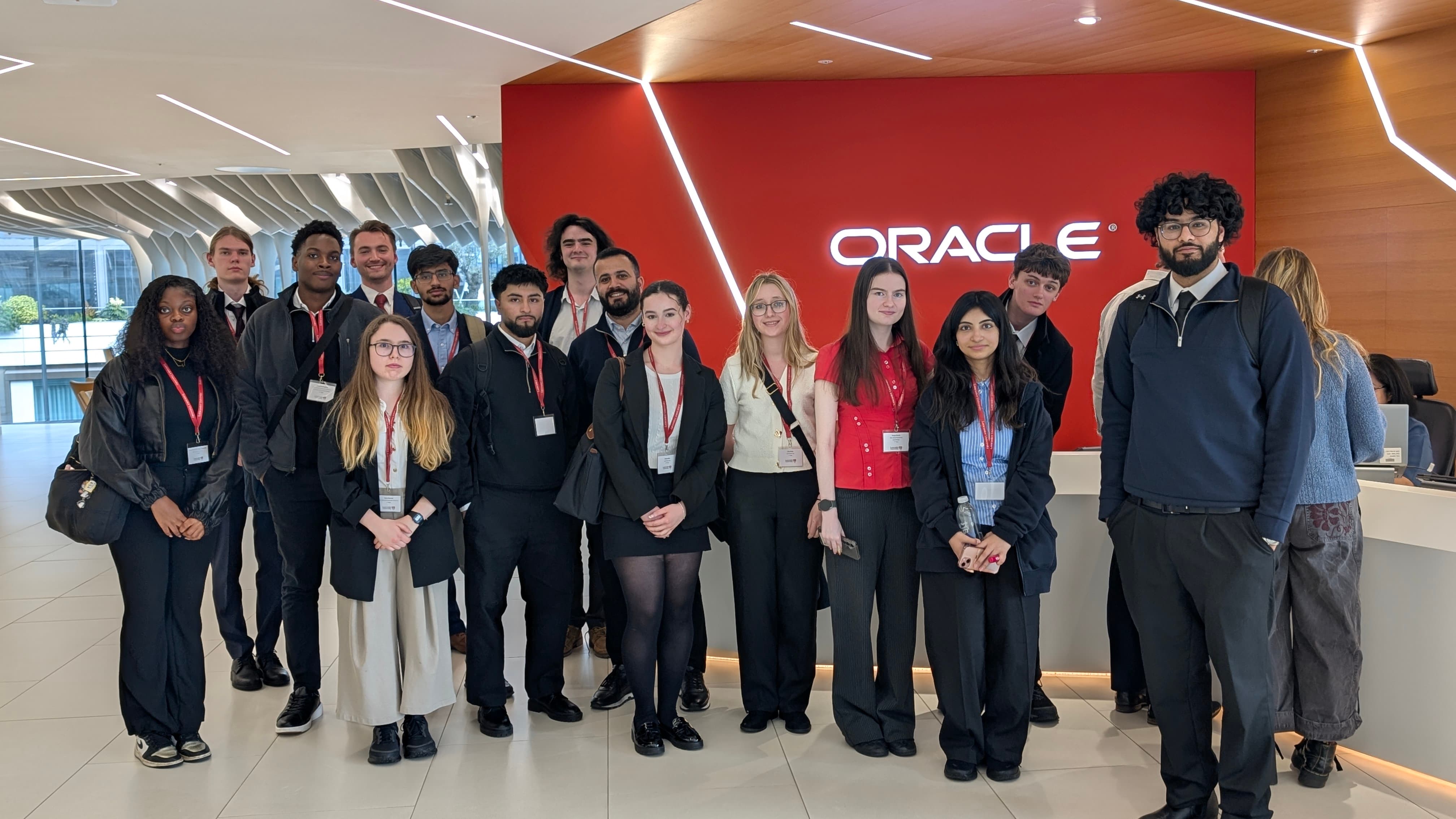 A group of students stand in the foyer of the Oracle offices on a visit during the Capital Connections trip to London