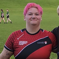 Image of Lillias Hodgson wearing a red and black top