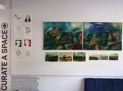 photo of the curate space wall in county bar with artwork