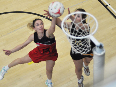 two girls playing netball