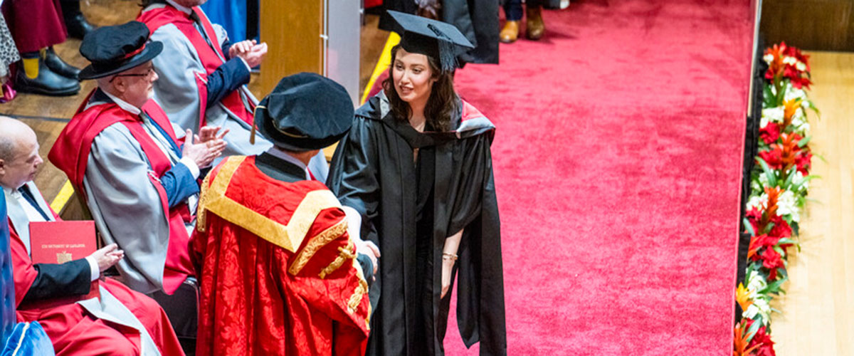Graduation ceremony student meeting the chancellor