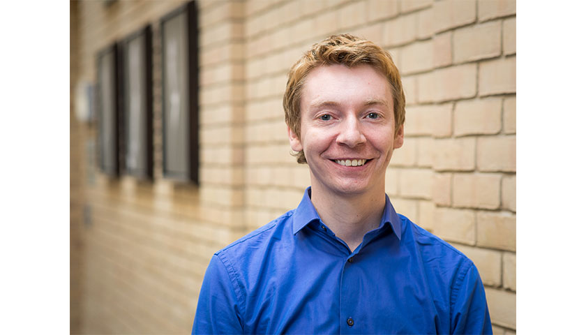 James Grime outside wearing a blue shirt