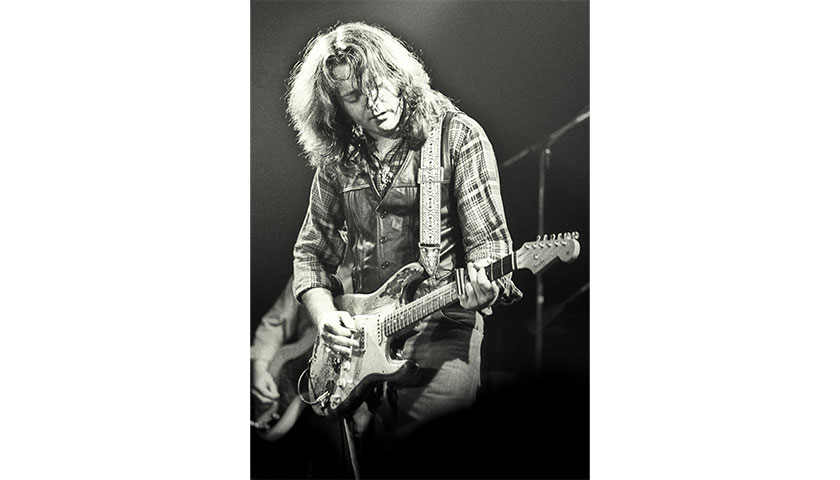 Rory Gallagher with guitar on Great Hall stage