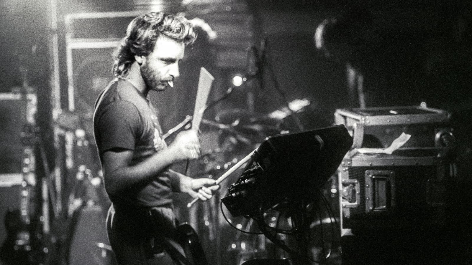 Peter Hook of New Order plays an electronic drum kit.