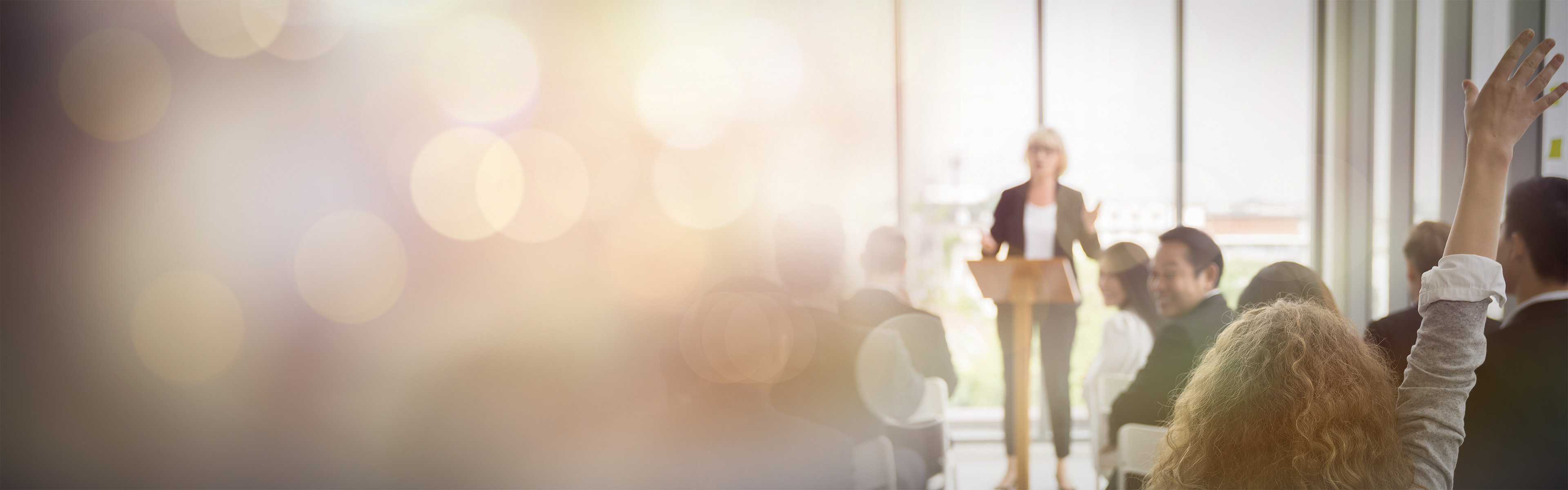 Female Presenter with audience at a cyber conference