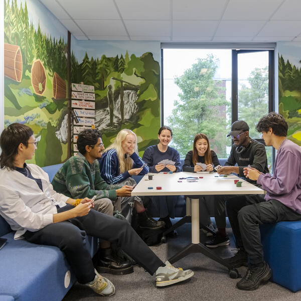 Group of students playing a board game