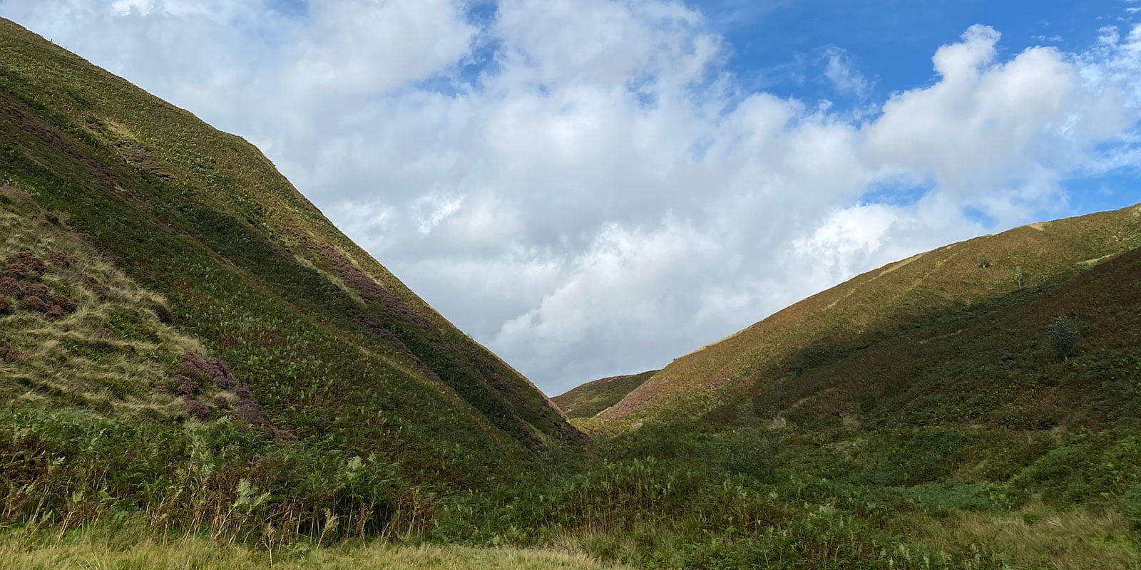 The valley in Forest Bowland with blue sky and clouds.