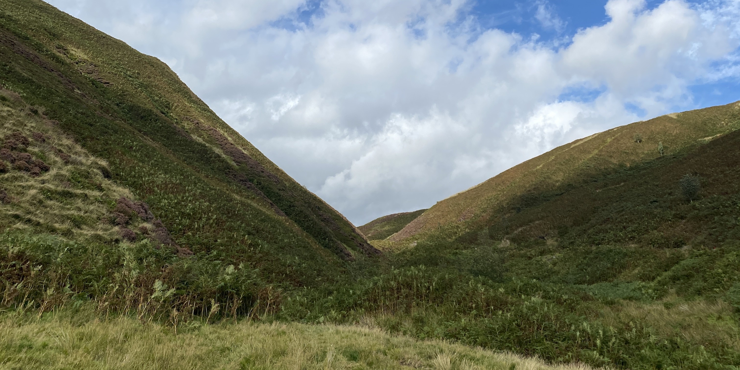 The valley in Forest Bowland with blue sky and clouds.