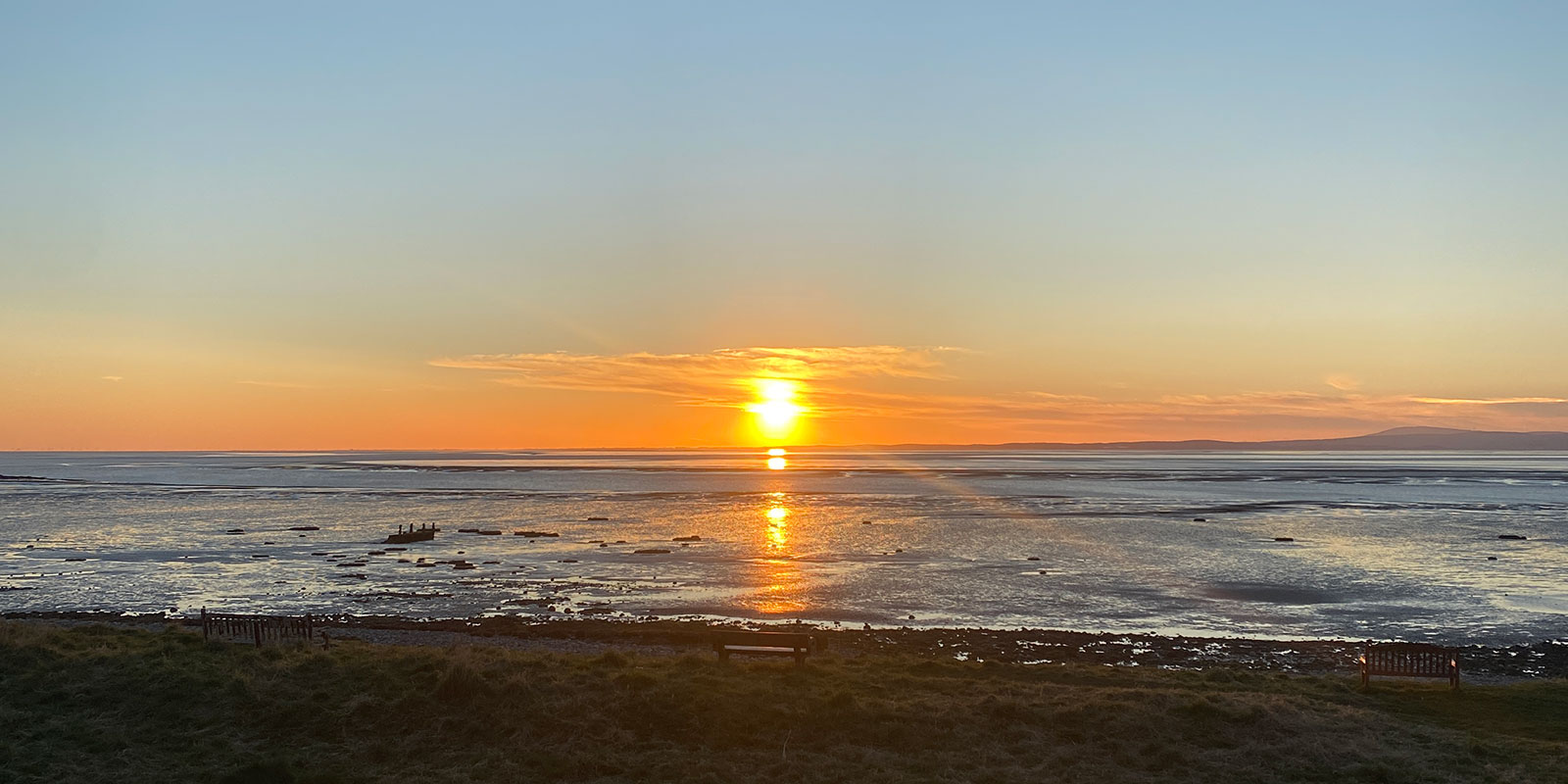 A sunset along the coast of Morecambe Bay at Hest Bank. 