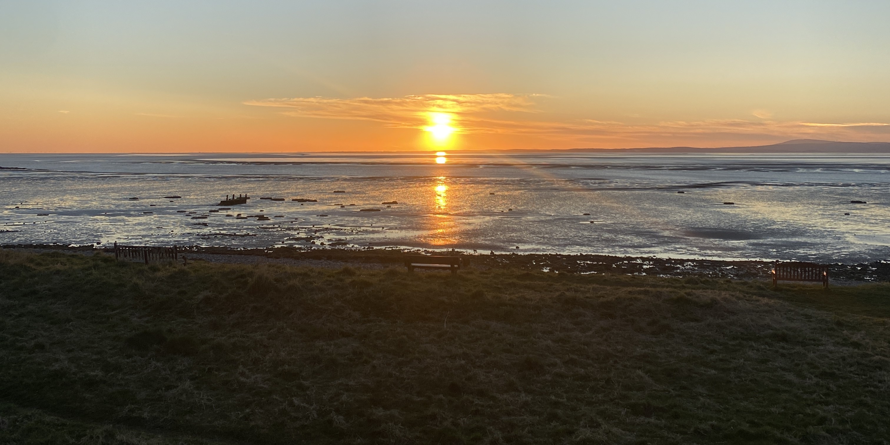 A sunset along the coast of Morecambe Bay at Hest Bank. 