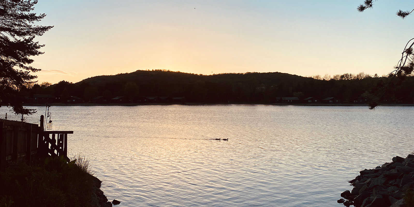 Coast of Pine Lake with the sunset at the back.