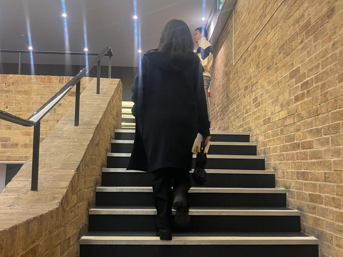 A person walking up the stairs. 