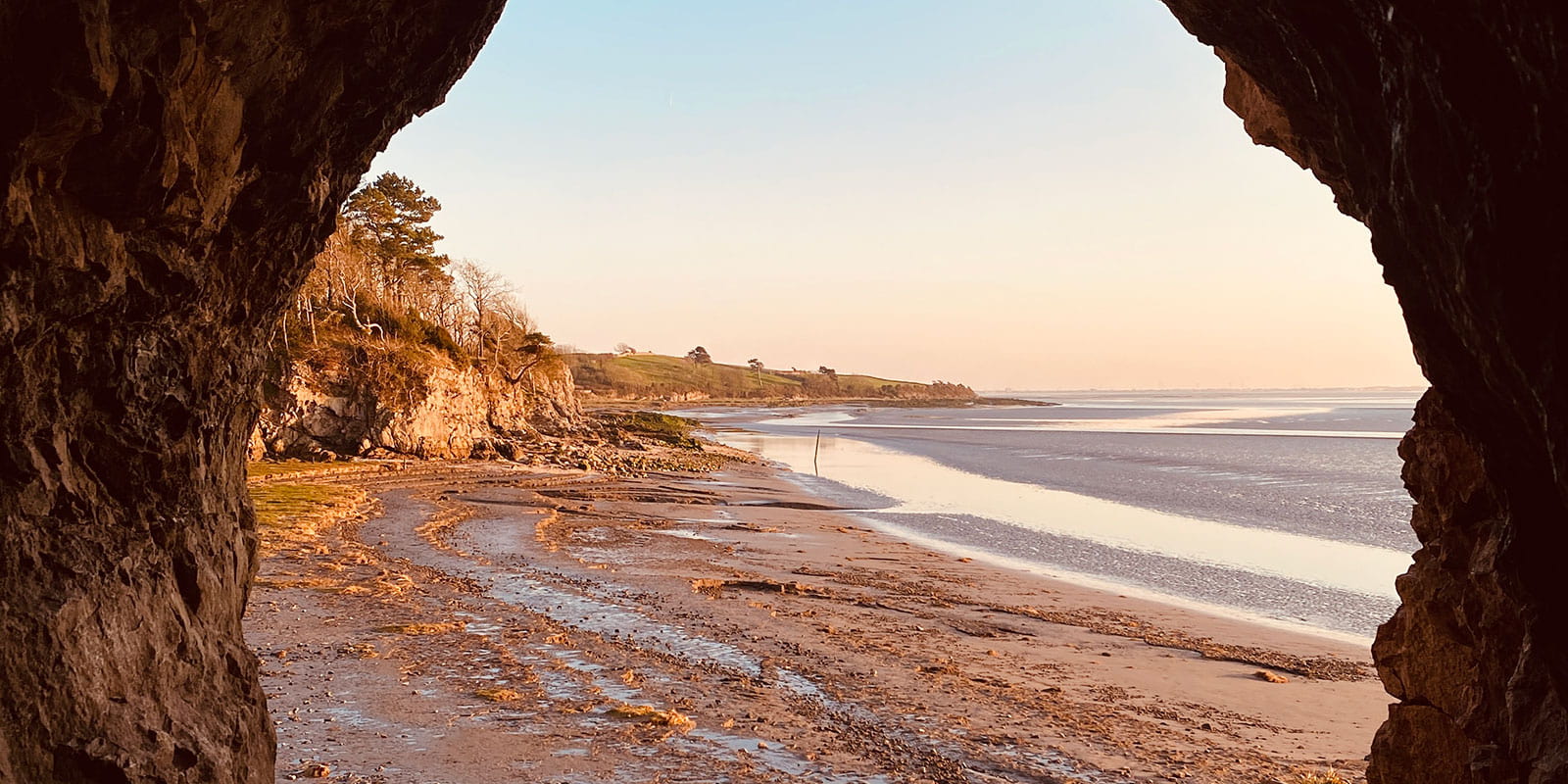 Inside the Silverdale Cove looking at the coast of it with a hint of light orange sunset. 