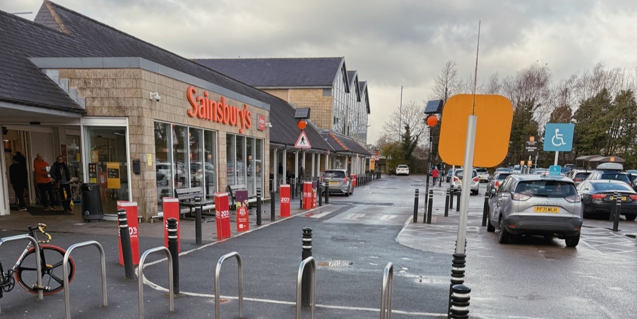 The entrence of the local supermarket, Sainsburys. 