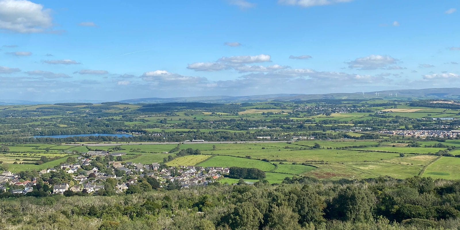 A scenic view of the Morecambe Bay and the countryside from the Warton Crag. 