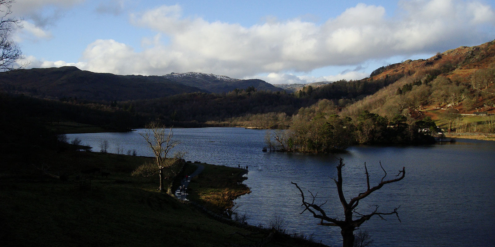 Image of the Lake District with the lake in the foreground, and the mountains in the background