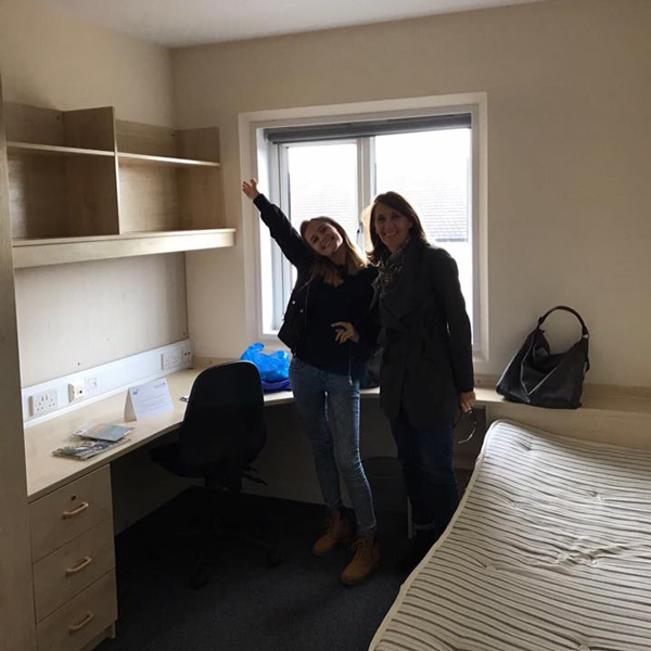 Alix and her mum in her room