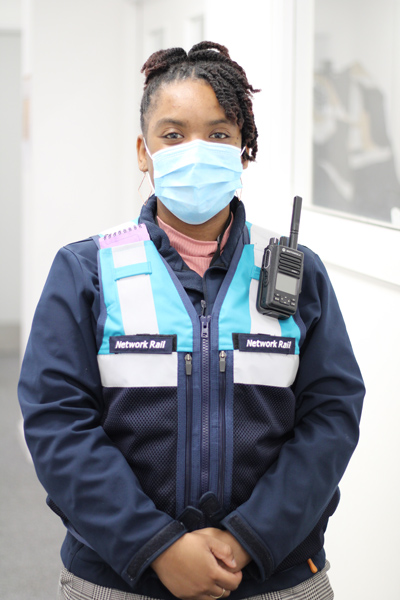 Chelsey in her uniform and a face mask