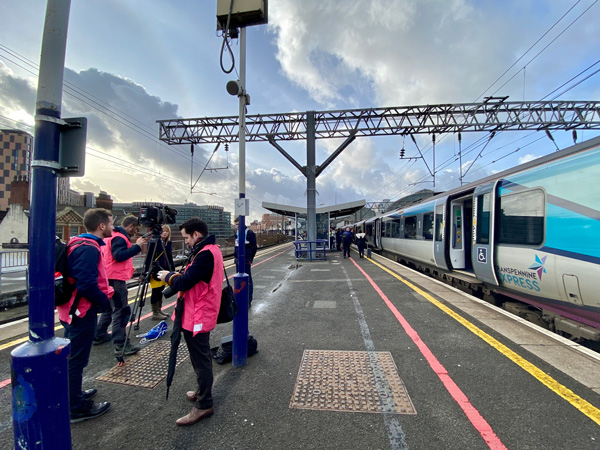 A film crew on the station platform